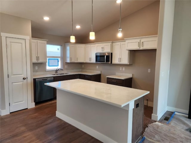 kitchen featuring pendant lighting, dishwasher, white cabinets, a kitchen island, and dark hardwood / wood-style flooring