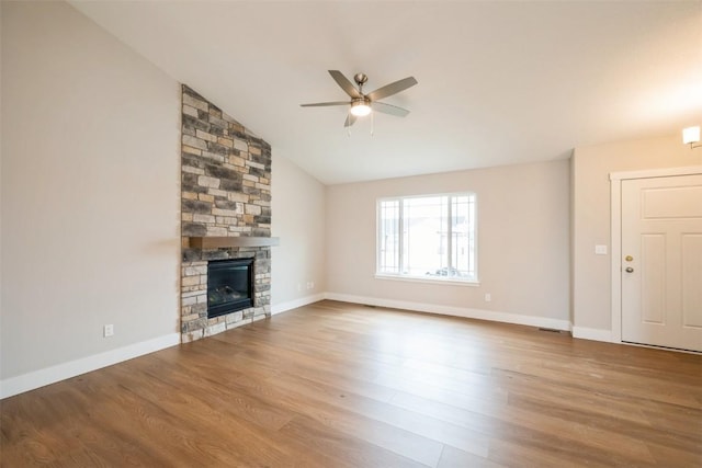 6188 Cope Dr, Marion, IA 52302 - unfurnished living room featuring a ceiling fan, wood finished floors, a fireplace, lofted ceiling, and baseboards