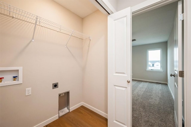 6188 Cope Dr, Marion, IA 52302 - laundry room featuring hookup for an electric dryer, washer hookup, and baseboards