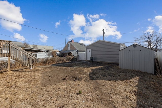 view of yard with a storage shed