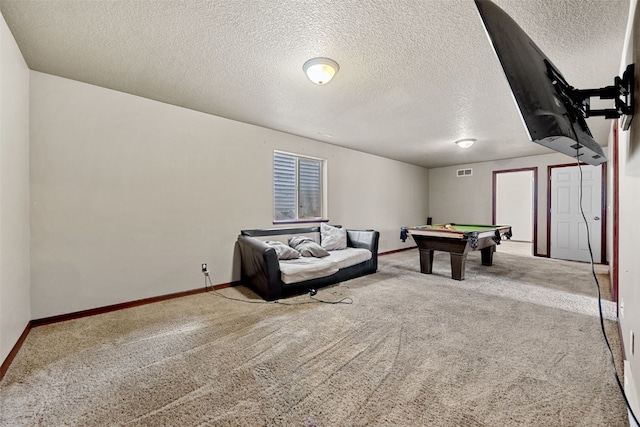 rec room with light carpet, a textured ceiling, and pool table