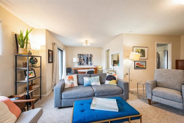 carpeted living room featuring a textured ceiling