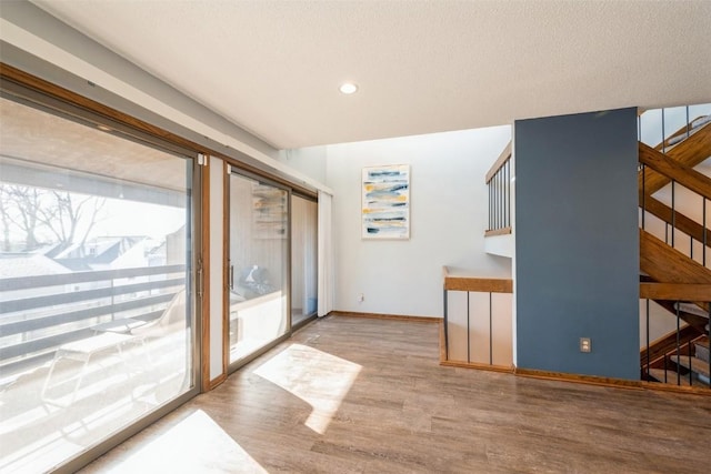 interior space featuring hardwood / wood-style floors and a healthy amount of sunlight