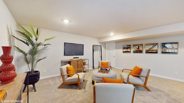 living area featuring light carpet