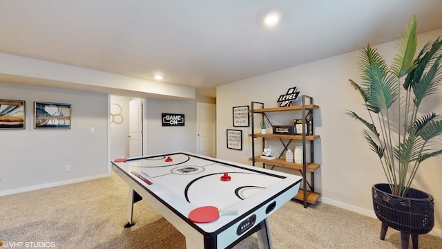 rec room with light colored carpet