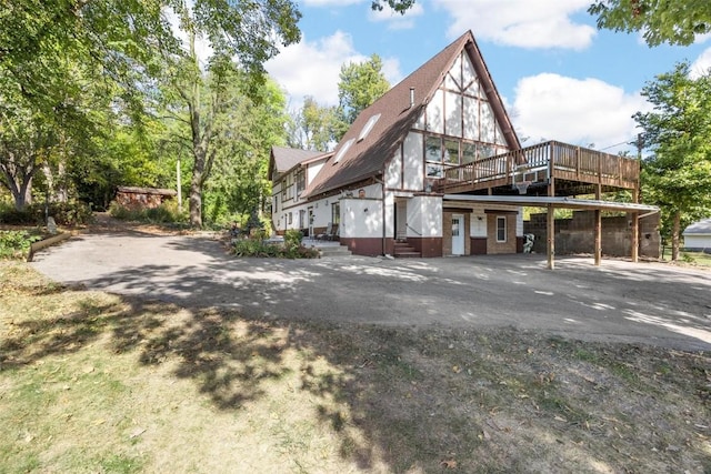 view of property exterior featuring a deck