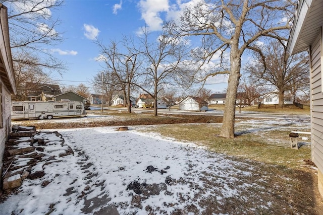 view of yard layered in snow