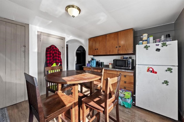 kitchen featuring dark wood-type flooring and white fridge