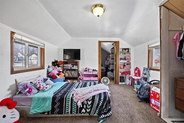 carpeted bedroom featuring lofted ceiling