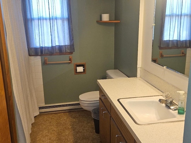 bathroom featuring toilet, a shower with curtain, vanity, and a baseboard radiator