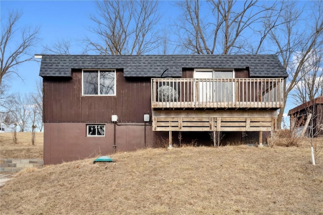 back of house featuring a wooden deck