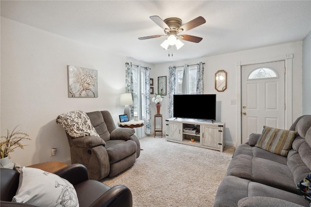 living room with light carpet and ceiling fan