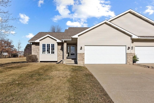 view of front of house with a front lawn and a garage