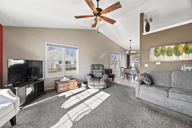 living room featuring carpet, ceiling fan with notable chandelier, and lofted ceiling