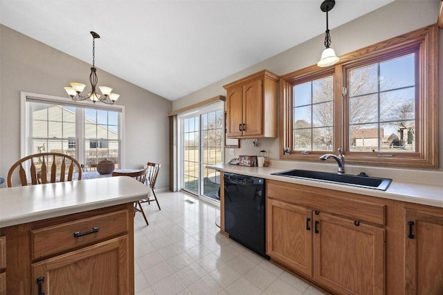 kitchen with pendant lighting, dishwasher, lofted ceiling, sink, and a chandelier