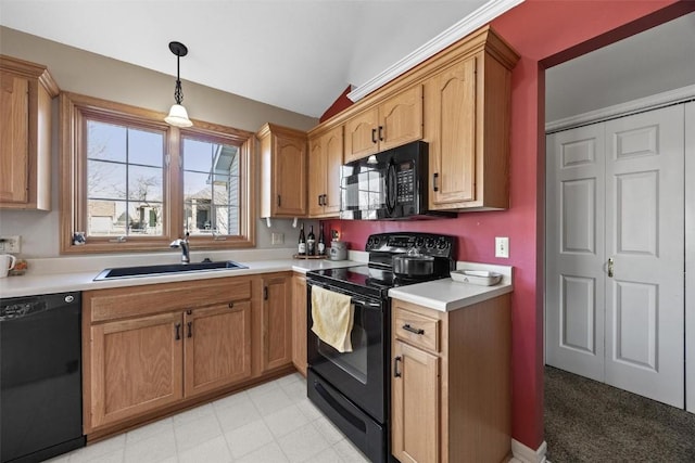 kitchen with vaulted ceiling, sink, pendant lighting, and black appliances