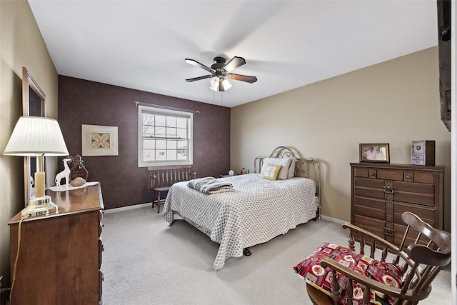 bedroom with ceiling fan and light carpet