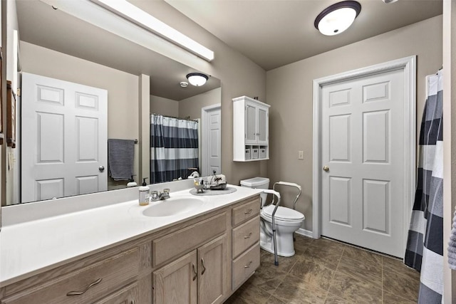 bathroom with toilet and vanity