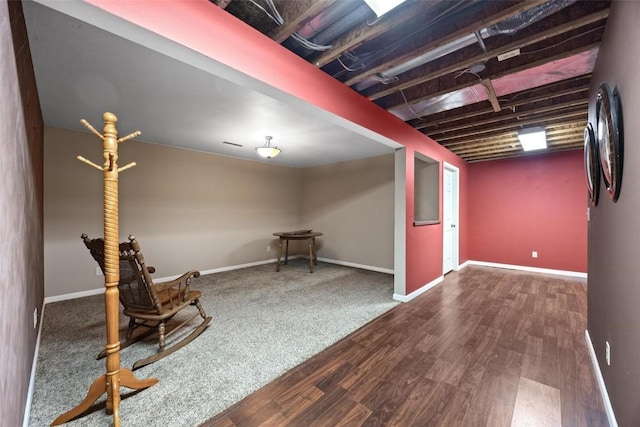 basement featuring dark hardwood / wood-style floors