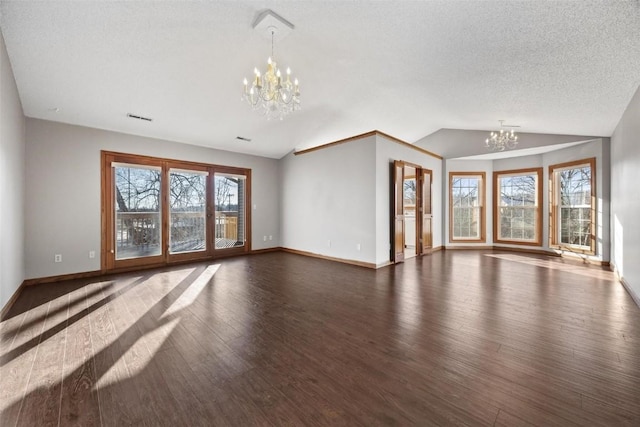 unfurnished living room featuring dark wood-type flooring, vaulted ceiling, a notable chandelier, and a textured ceiling