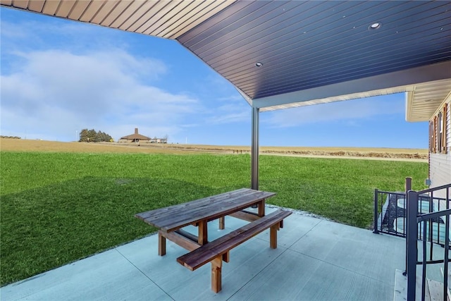 view of patio with a rural view