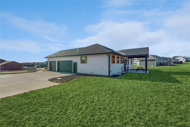 view of home's exterior with a garage and a yard