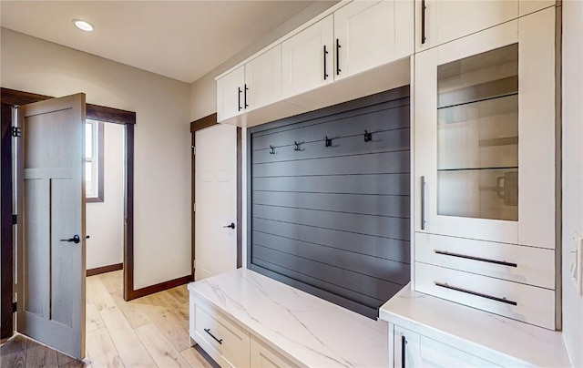 mudroom featuring baseboards, light wood-style flooring, and recessed lighting