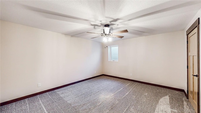 unfurnished room featuring carpet floors, ceiling fan, and a textured ceiling