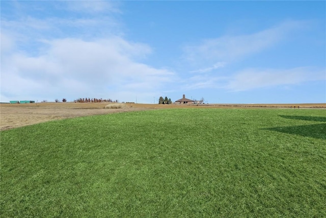 view of yard with a rural view