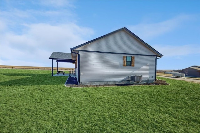 view of property exterior with cooling unit and a lawn