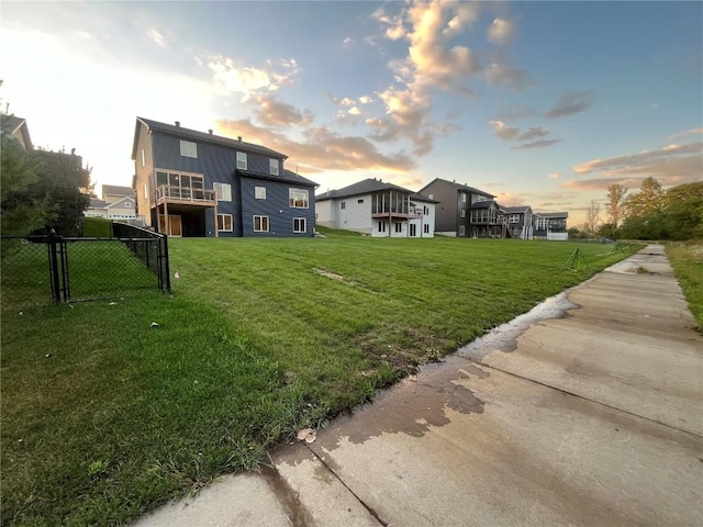 view of yard at dusk