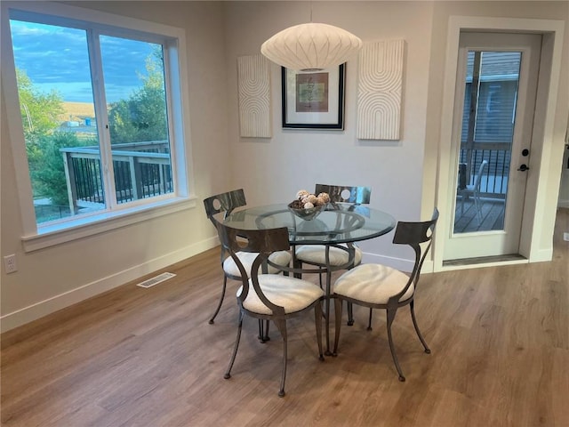 dining space featuring hardwood / wood-style flooring