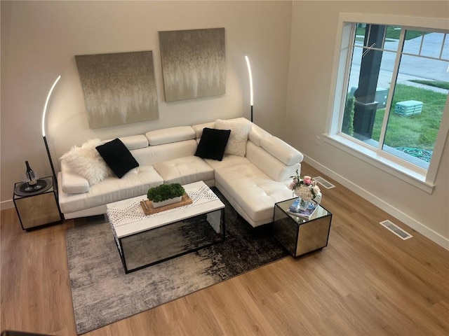 living room with light hardwood / wood-style floors