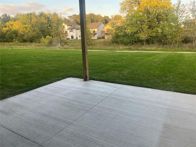 patio terrace at dusk with a lawn