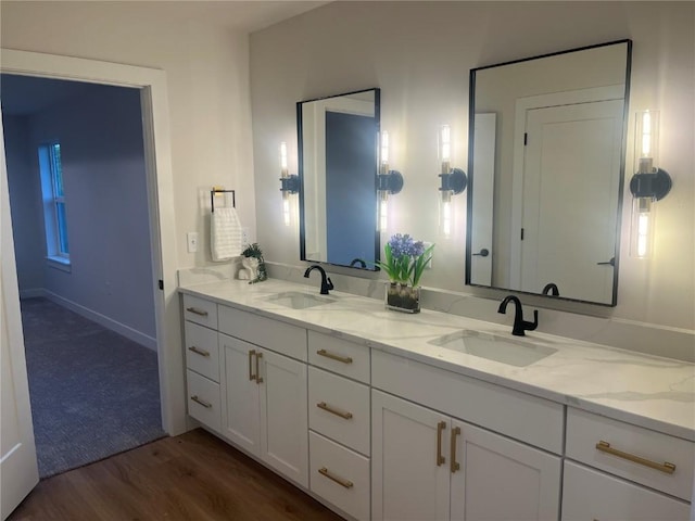 bathroom featuring vanity and wood-type flooring