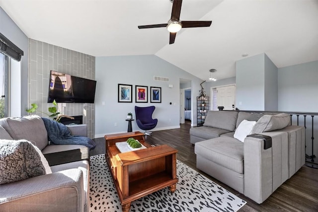 living room with vaulted ceiling, ceiling fan, and dark hardwood / wood-style flooring