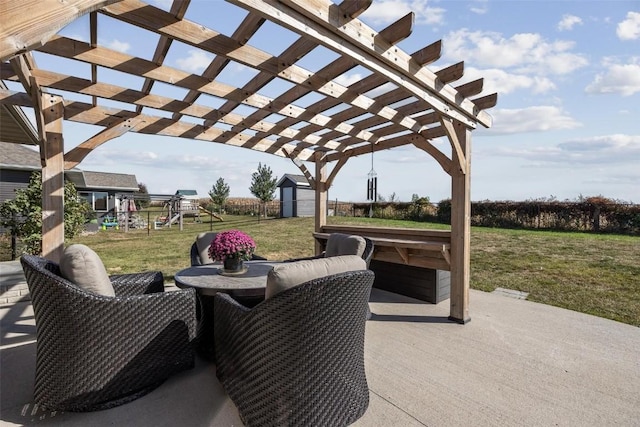 view of patio / terrace featuring a playground, a pergola, a shed, and an outdoor hangout area