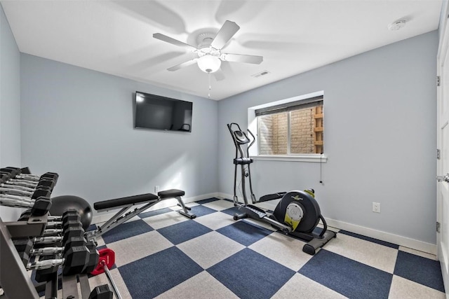 exercise room with ceiling fan