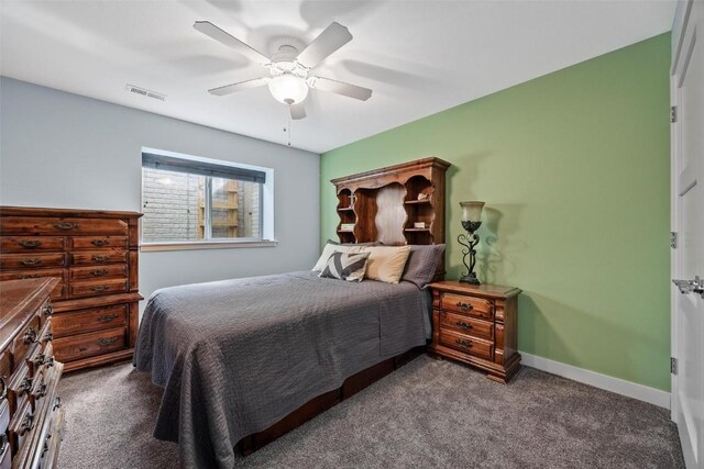 bedroom featuring ceiling fan and dark colored carpet