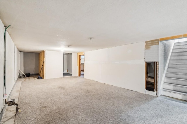 basement featuring light carpet