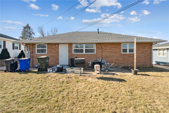 back of property with central AC unit, a patio area, and a yard