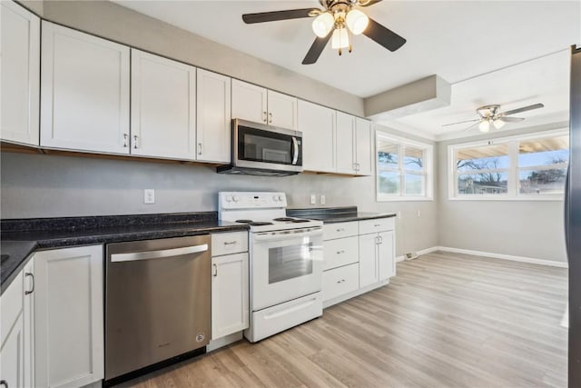 kitchen featuring white cabinetry, light hardwood / wood-style flooring, ceiling fan, and appliances with stainless steel finishes