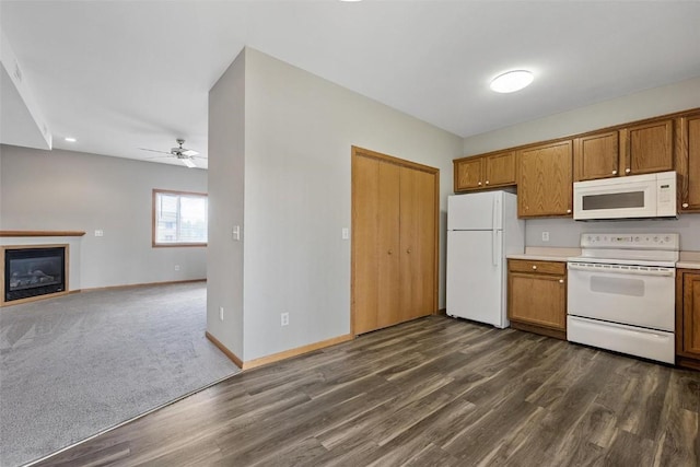 kitchen featuring ceiling fan, white appliances, and dark hardwood / wood-style floors