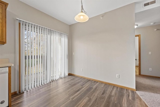 unfurnished dining area with hardwood / wood-style flooring