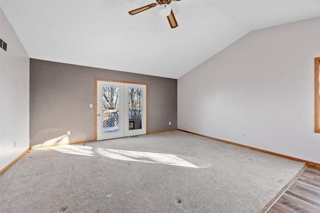 unfurnished living room with ceiling fan and lofted ceiling