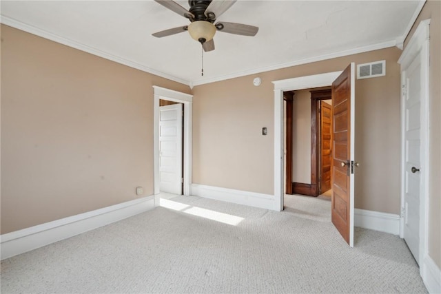 unfurnished bedroom with crown molding, ceiling fan, and light carpet