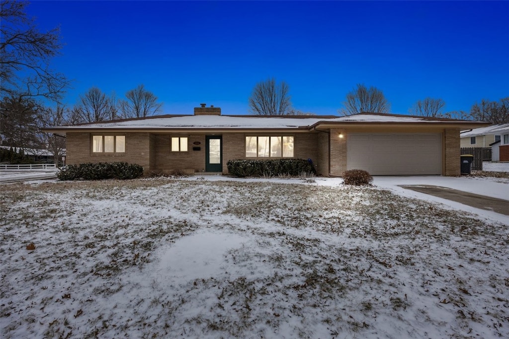 ranch-style house featuring a garage