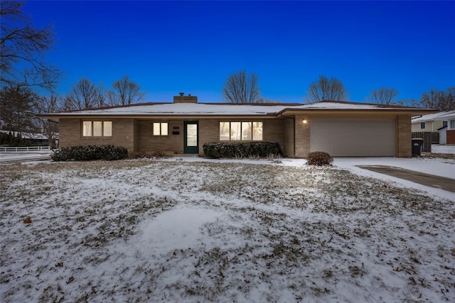 ranch-style house featuring a garage