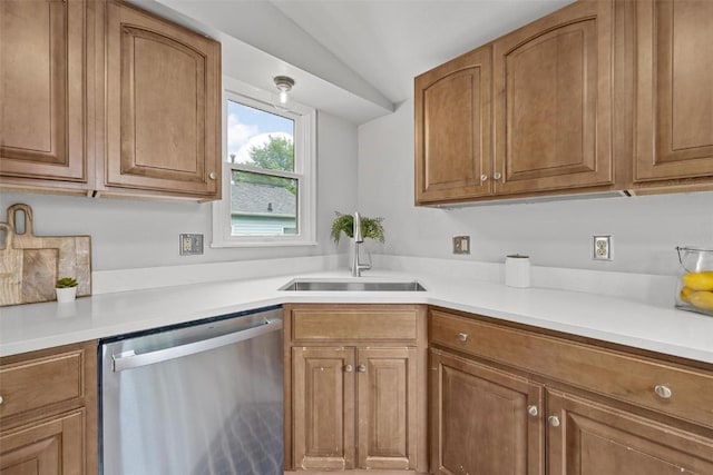 kitchen with lofted ceiling, sink, and dishwasher