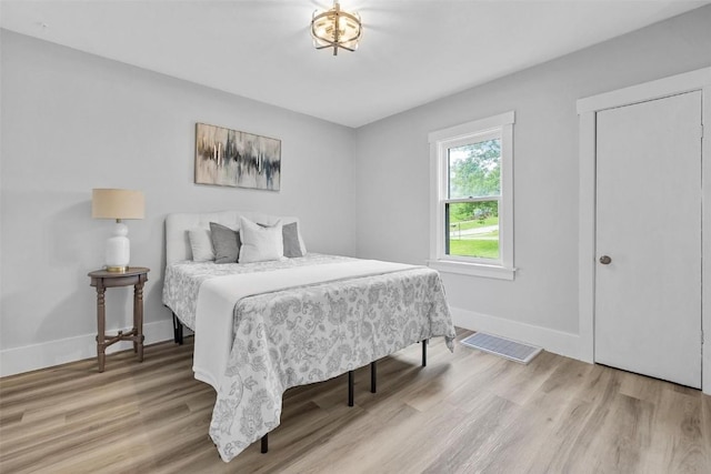 bedroom with light hardwood / wood-style flooring